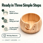 Elevated view inside the wooden yarn bowl
